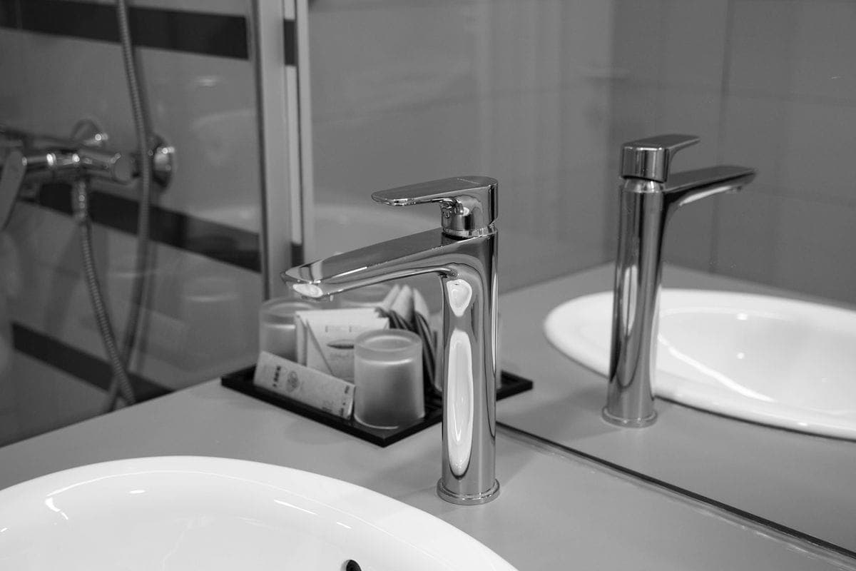 Bathroom basin with a stainless steel tap